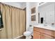 Bathroom with a wood vanity and tiled floors at 9413 Carnaby Dr, Venice, FL 34293