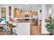 Well-lit kitchen with stainless steel appliances, ample counter space, and a breakfast bar for casual dining at 9413 Carnaby Dr, Venice, FL 34293