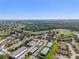 Sprawling community with lush landscaping, golf course, and ample parking at 942 Capri Isles Blvd # 105, Venice, FL 34292