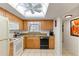 Efficient kitchen features bright cabinets, granite countertops, and tile flooring at 942 Capri Isles Blvd # 105, Venice, FL 34292