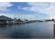 Scenic view of a marina filled with boats and yachts against a backdrop of a blue sky and buildings at 942 Capri Isles Blvd # 105, Venice, FL 34292