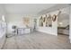 Spacious living room features light wood floors, vaulted ceilings, and a custom built-in pet crate at 10047 Greetings St, Port Charlotte, FL 33981