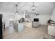 Spacious open-concept seamlessly connecting the kitchen, dining, and living areas, ideal for entertaining at 10047 Greetings St, Port Charlotte, FL 33981