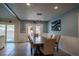 Cozy dining room includes patio access and comfortably seats six, adjacent to both the kitchen and pool area at 1008 Euclid Rd, Venice, FL 34293