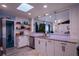 Updated kitchen featuring white cabinets, granite countertops, stainless steel appliances, and modern fixtures and finishes at 1008 Euclid Rd, Venice, FL 34293