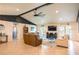 Spacious living room with tile floors and access to the pool area through sliding glass doors at 1008 Euclid Rd, Venice, FL 34293