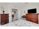 Well-lit bedroom showcasing the bedroom's design and access to adjoining spaces at 11007 Batello Dr, Venice, FL 34292