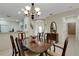 Formal dining room featuring a wooden table set and a view into the adjacent kitchen at 11007 Batello Dr, Venice, FL 34292