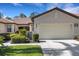 Charming home featuring a two-car garage, well-kept lawn, and lush landscaping at 11007 Batello Dr, Venice, FL 34292