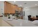 Contemporary kitchen featuring stainless steel appliances, wooden cabinets, and breakfast bar seating at 11007 Batello Dr, Venice, FL 34292