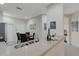 Well-lit kitchen featuring stone countertops, a stainless steel sink and faucet, and an adjacent dining area at 11007 Batello Dr, Venice, FL 34292