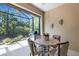Inviting outdoor patio with a view of lush greenery, perfect for outdoor dining at 11007 Batello Dr, Venice, FL 34292