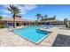 Large community pool with ample seating, ideal for socializing and enjoying recreational activities outdoors at 11007 Batello Dr, Venice, FL 34292