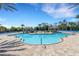 Resort-style pool with cabanas and lounge chairs, perfect for relaxing and enjoying the Florida sunshine in luxury at 11007 Batello Dr, Venice, FL 34292