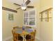 The dining area features a ceiling fan and shuttered windows at 11096 Campazzo Dr, Venice, FL 34292