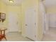 Inviting foyer features neutral tile flooring, and natural light at 11096 Campazzo Dr, Venice, FL 34292