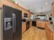 Modern kitchen with stainless steel appliances, granite countertops, and ample cabinet space at 11924 Tempest Harbor Loop, Venice, FL 34292