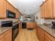 Well-equipped kitchen with granite countertops, stainless appliances, and an open layout at 11924 Tempest Harbor Loop, Venice, FL 34292