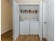 This laundry room features a full-sized washer and dryer in a closet at 11924 Tempest Harbor Loop, Venice, FL 34292
