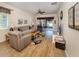 Bright living room featuring stylish furniture, laminate floors, and a view of the lanai at 11924 Tempest Harbor Loop, Venice, FL 34292