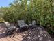 Inviting outdoor patio with seating, perfect for relaxation and enjoying the surrounding greenery at 11924 Tempest Harbor Loop, Venice, FL 34292