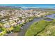 Wide angle aerial showcasing a waterfront home with dock and a community surrounded by waterways at 1500 Lemon Bay Dr, Venice, FL 34293