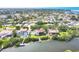 Aerial shot shows a waterfront home with private dock, close to community and beautiful waterways at 1500 Lemon Bay Dr, Venice, FL 34293