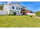 A spacious backyard with a well-maintained lawn and a charming fire pit area at 1500 Lemon Bay Dr, Venice, FL 34293