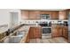 Modern kitchen showcasing granite countertops, stainless steel appliances, and ample cabinet space at 1500 Lemon Bay Dr, Venice, FL 34293