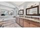 Luxurious bathroom with dual sinks, granite countertops and a soaking tub at 1500 Lemon Bay Dr, Venice, FL 34293