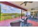 Enjoy beautiful views from the covered deck, with dining and lounge areas at 1500 Lemon Bay Dr, Venice, FL 34293