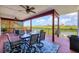 Relax on this spacious covered patio, offering tranquil water views and comfortable seating at 1500 Lemon Bay Dr, Venice, FL 34293