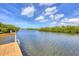 View of the tranquil water and lush vegetation from a private dock, offering a serene experience at 1500 Lemon Bay Dr, Venice, FL 34293