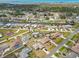 Aerial view showcases the coastal neighborhood with canals, houses, and the ocean in the background at 1537 Overbrook Rd, Englewood, FL 34223