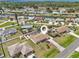 Expansive aerial view of home featuring a private pool, canal access, and lush landscaping at 1537 Overbrook Rd, Englewood, FL 34223