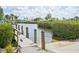 Community boat ramp providing easy access to the water, surrounded by lush landscaping and clear skies at 1537 Overbrook Rd, Englewood, FL 34223