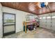 Spacious garage with workbench and ample storage, perfect for projects and organization at 1537 Overbrook Rd, Englewood, FL 34223