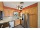 Functional kitchen with stainless steel appliances and ample cabinet space at 1537 Overbrook Rd, Englewood, FL 34223