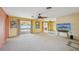 Spacious living room showcasing access to the pool area and abundant natural light at 1537 Overbrook Rd, Englewood, FL 34223