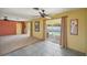 Open living area with sliding door access to the screened pool, blending indoor and outdoor living at 1537 Overbrook Rd, Englewood, FL 34223