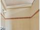 A close-up of the shower featuring light brown tiles with brown trim at 1537 Overbrook Rd, Englewood, FL 34223