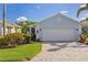 Single-story home with a two-car garage, complemented by a paver driveway and well-maintained landscaping at 1625 Lancashire Dr, Venice, FL 34293