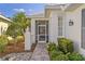 Inviting home with landscaped front yard and screened-in porch entry at 1625 Lancashire Dr, Venice, FL 34293