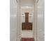 Hallway view of the bathroom with and sinks and cabinets at 1625 Lancashire Dr, Venice, FL 34293