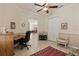 Spacious office featuring a desk, comfortable arm chair, and views to the dining room at 1625 Lancashire Dr, Venice, FL 34293