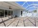 Screened-in patio featuring a tiled floor, fan, and provides a relaxing outdoor living space at 1625 Lancashire Dr, Venice, FL 34293