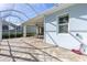 An expansive screened-in lanai with a paver floor, offering an inviting outdoor entertaining area at 1625 Lancashire Dr, Venice, FL 34293