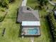 Aerial view of a beautiful home with a screened-in pool and large backyard at 1653 Albino St, Nokomis, FL 34275