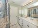 Bathroom features double sinks, tile floors, and plenty of vanity storage space at 1653 Albino St, Nokomis, FL 34275