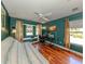 Comfortable bedroom featuring a desk and chair in front of the bright window seat at 1653 Albino St, Nokomis, FL 34275